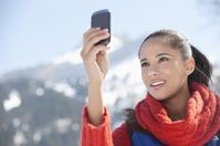 95031 Woman checking cell phone with mountain in background (1).jpg